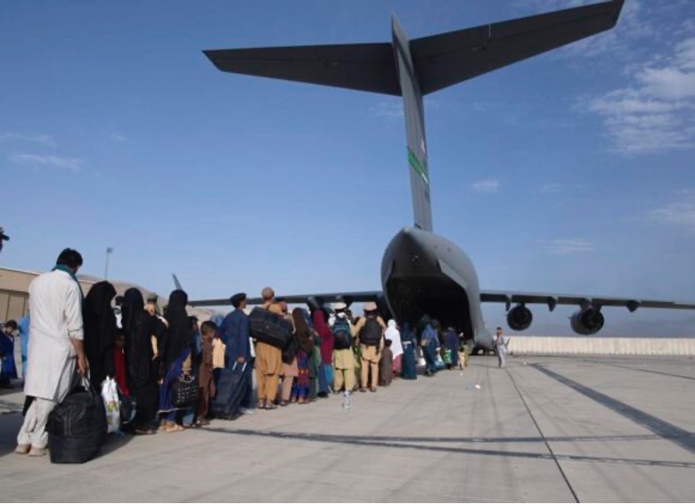 Photo from Lifeline Afghanistan, lineup of people boarding a plane